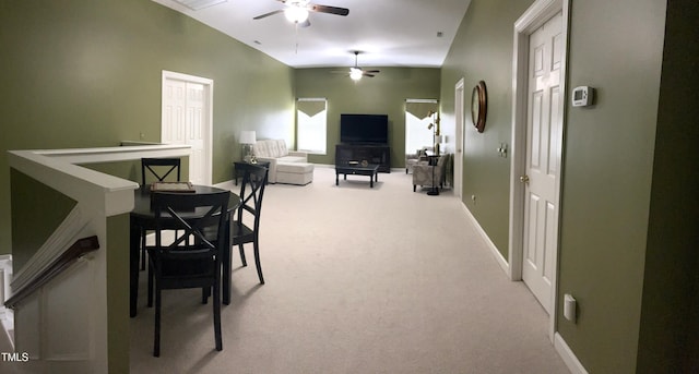 dining room with ceiling fan, carpet flooring, and baseboards