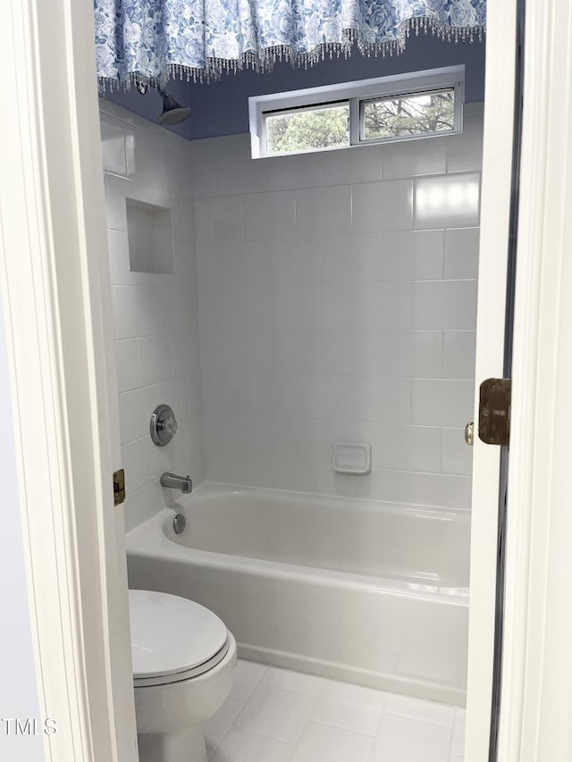 full bathroom featuring toilet, washtub / shower combination, and tile patterned floors