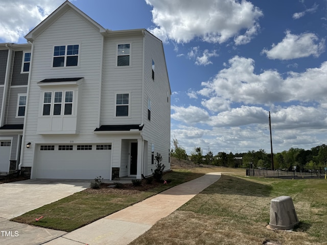 view of front of home with a garage and driveway