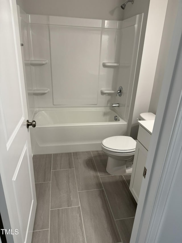 full bathroom featuring vanity, shower / bathtub combination, and toilet
