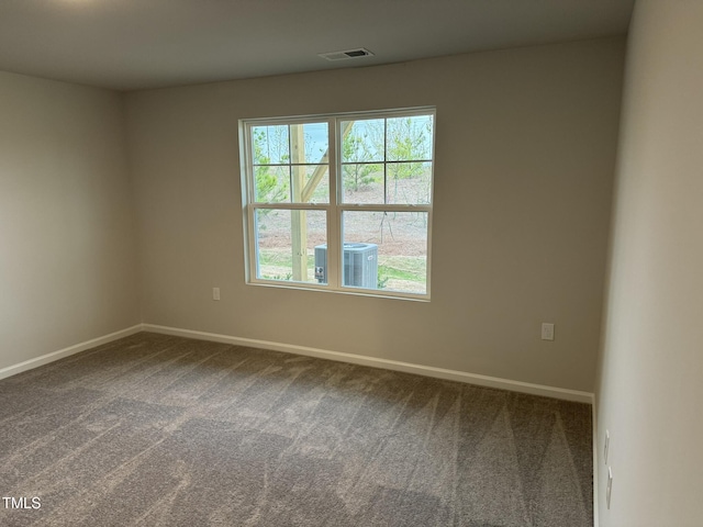 spare room with carpet and baseboards