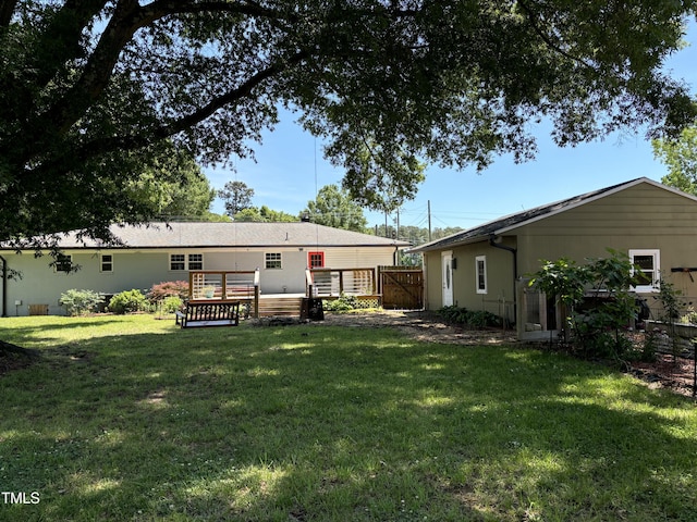 704 S Mineral Springs Rd, Durham, NC 27703 - rear view of house with a deck