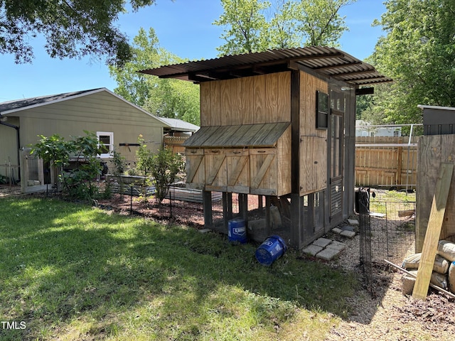 704 S Mineral Springs Rd, Durham, NC 27703 - rear view of property featuring exterior structure and an outbuilding