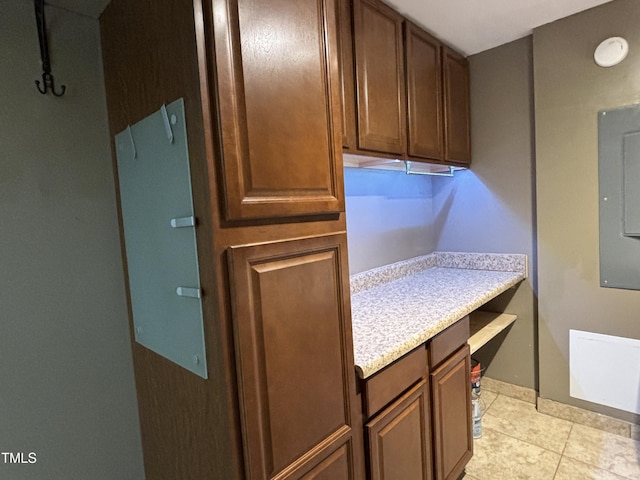 704 S Mineral Springs Rd, Durham, NC 27703 - kitchen with light countertops, light tile patterned floors, and baseboards