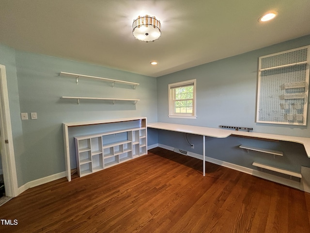 704 S Mineral Springs Rd, Durham, NC 27703 - unfurnished office with wood finished floors, baseboards, built in study area, and recessed lighting