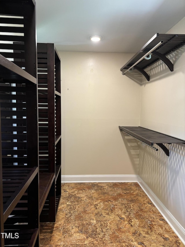 704 S Mineral Springs Rd, Durham, NC 27703 - walk in closet featuring stone finish flooring