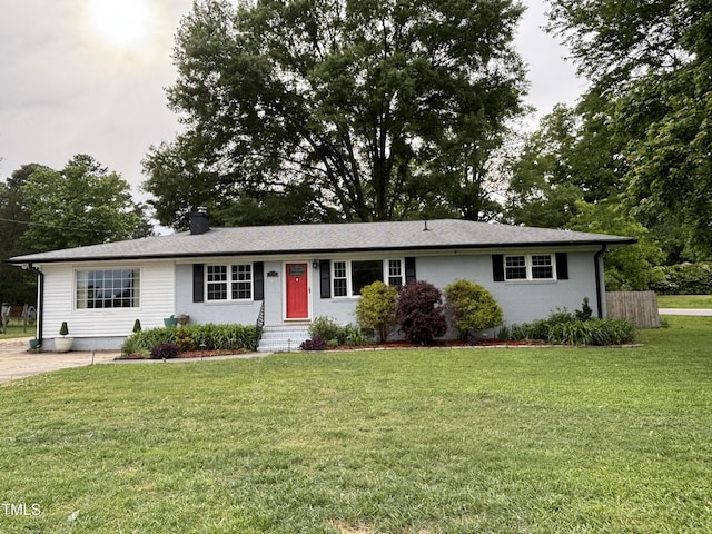 704 S Mineral Springs Rd, Durham, NC 27703 - ranch-style home featuring a front yard, entry steps, and a chimney