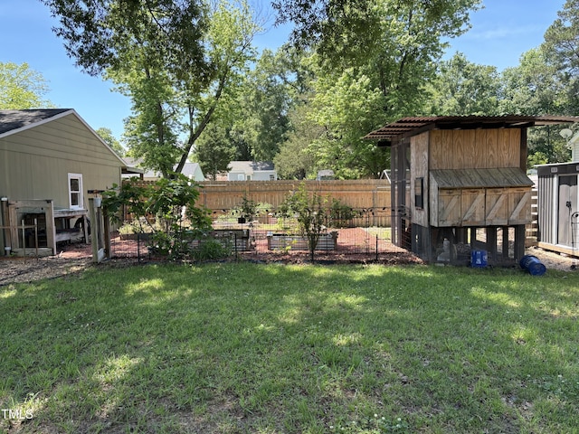704 S Mineral Springs Rd, Durham, NC 27703 - view of yard featuring a vegetable garden and an outdoor structure
