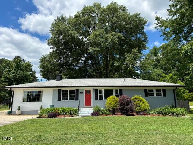 704 S Mineral Springs Rd, Durham, NC 27703 - ranch-style house featuring a front yard and a chimney