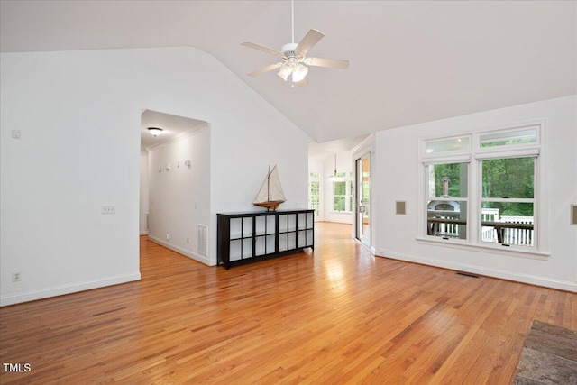 unfurnished living room with ceiling fan, light wood-style floors, baseboards, and high vaulted ceiling