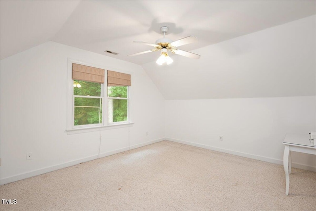 additional living space featuring lofted ceiling, carpet, ceiling fan, and baseboards