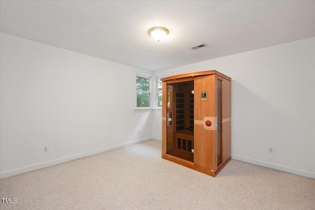 additional living space featuring carpet floors and baseboards