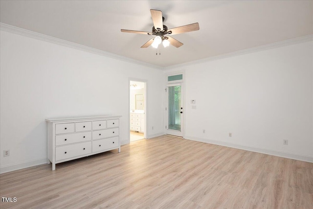 spare room featuring ceiling fan, light wood-style flooring, crown molding, and baseboards