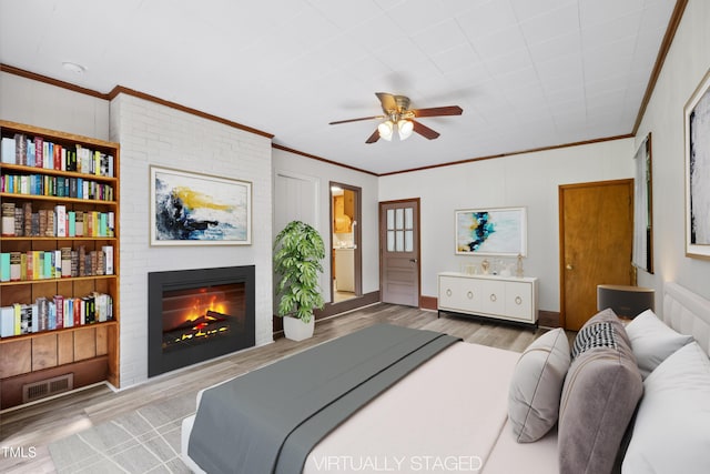 330 Wilmot Dr, Raleigh, NC 27606 - bedroom featuring crown molding, wood finished floors, a fireplace, and a ceiling fan