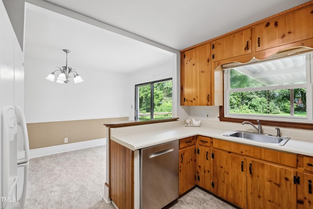 330 Wilmot Dr, Raleigh, NC 27606 - kitchen featuring stainless steel dishwasher, a sink, light countertops, a chandelier, and a wainscoted wall