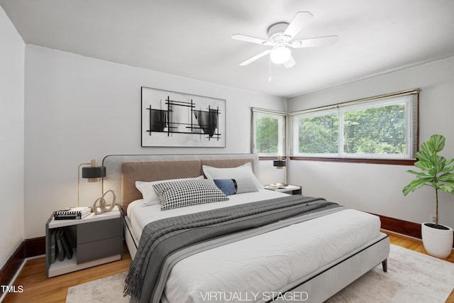 330 Wilmot Dr, Raleigh, NC 27606 - bedroom with baseboards, wood finished floors, and ceiling fan