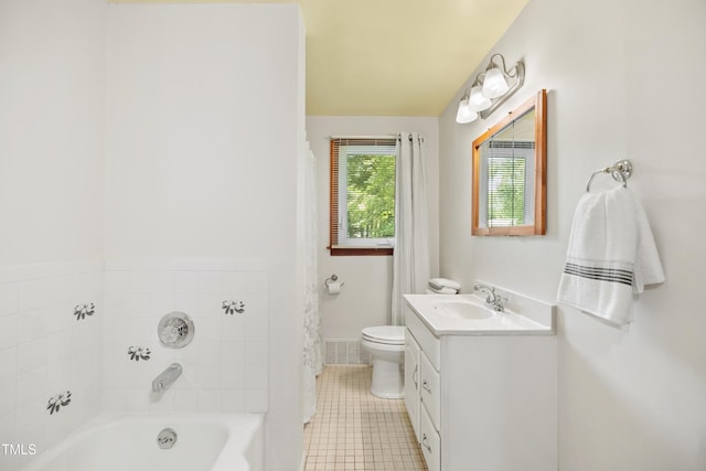 330 Wilmot Dr, Raleigh, NC 27606 - full bath with a tub, vanity, tile patterned flooring, toilet, and baseboards