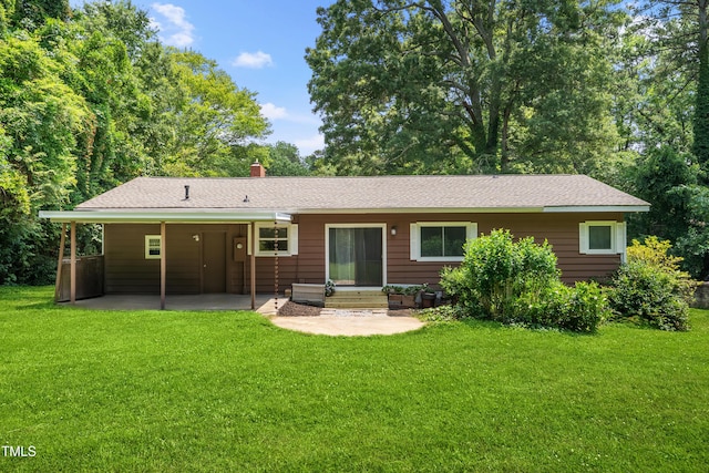 330 Wilmot Dr, Raleigh, NC 27606 - back of house featuring a patio area, a lawn, a chimney, and entry steps