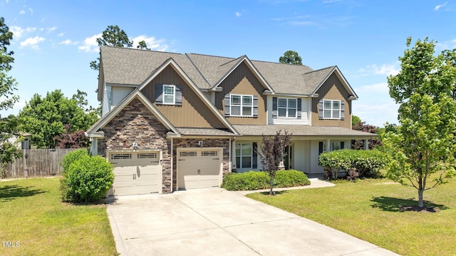 870 Kentucky Derby Ln, Lillington, NC 27546 - craftsman-style home with concrete driveway, stone siding, a shingled roof, board and batten siding, and an attached garage