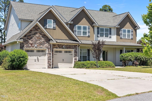 870 Kentucky Derby Ln, Lillington, NC 27546 - view of front facade featuring concrete driveway, a front lawn, stone siding, and roof with shingles