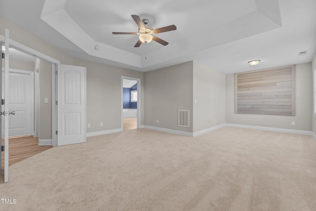 870 Kentucky Derby Ln, Lillington, NC 27546 - unfurnished room featuring a raised ceiling, ceiling fan, carpet floors, and baseboards