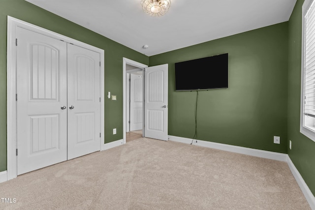 870 Kentucky Derby Ln, Lillington, NC 27546 - unfurnished bedroom with carpet floors, baseboards, and a closet