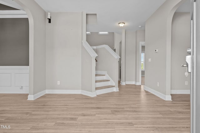 870 Kentucky Derby Ln, Lillington, NC 27546 - foyer featuring arched walkways, light wood-style flooring, stairs, and baseboards