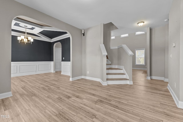 870 Kentucky Derby Ln, Lillington, NC 27546 - additional living space with a chandelier, light wood-type flooring, stairway, arched walkways, and beamed ceiling