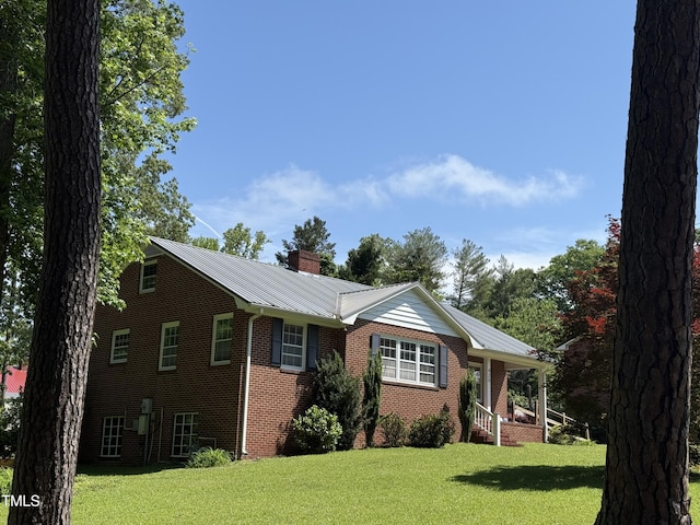 420 Rodwell St, Warrenton, NC 27589 - ranch-style house featuring brick siding, a front yard, and a chimney