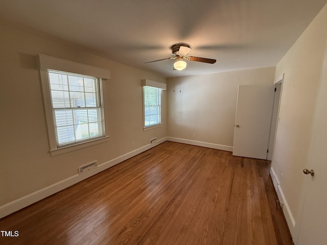 420 Rodwell St, Warrenton, NC 27589 - empty room with wood finished floors, a ceiling fan, and baseboards