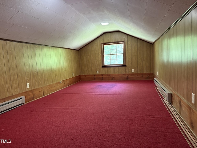 420 Rodwell St, Warrenton, NC 27589 - additional living space featuring a baseboard heating unit, vaulted ceiling, wooden walls, and carpet floors