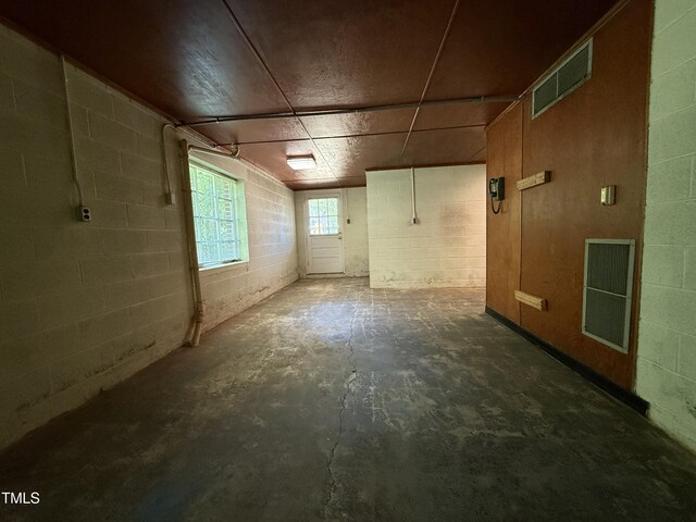 420 Rodwell St, Warrenton, NC 27589 - interior space with concrete floors and concrete block wall
