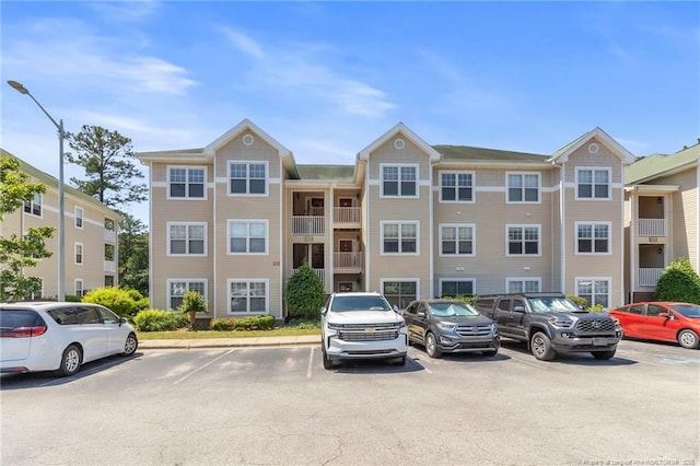 view of property with uncovered parking