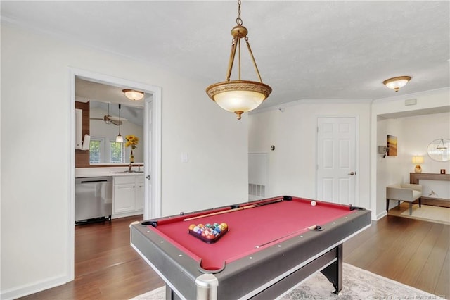 rec room featuring dark wood-style floors, billiards table, crown molding, baseboards, and a sink