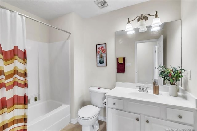 bathroom featuring toilet, vanity, and shower / tub combo