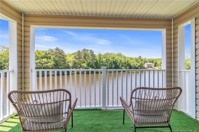 balcony featuring a water view