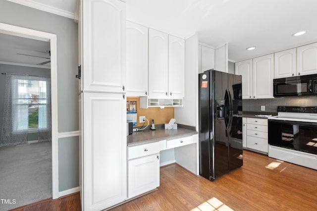 kitchen with black appliances, white cabinets, ornamental molding, backsplash, and light wood finished floors