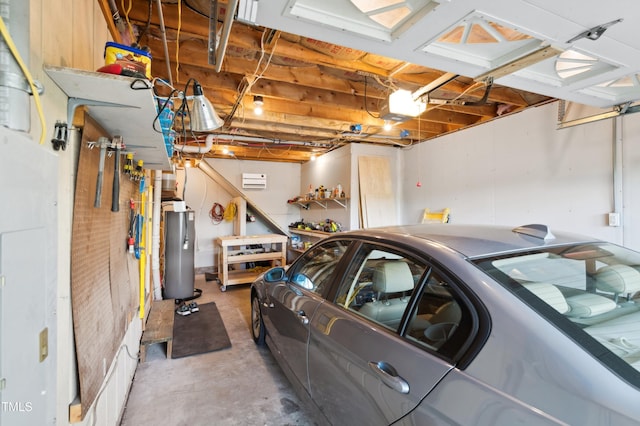 garage featuring water heater and a garage door opener