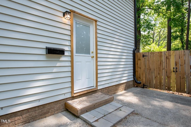 property entrance with fence