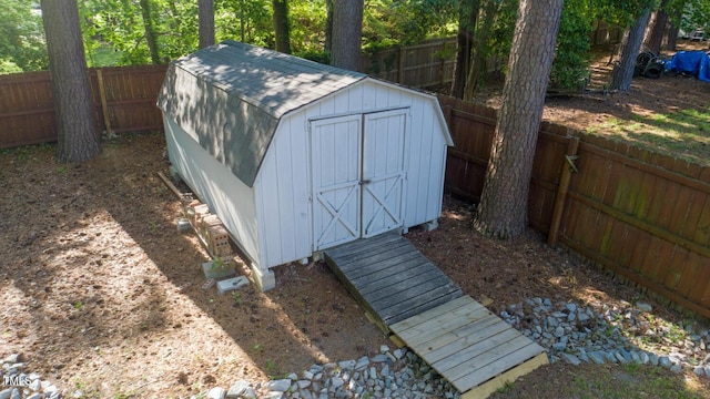 view of shed with a fenced backyard