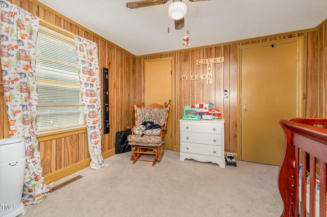 80 Lewis Moody Rd, Bear Creek, NC 27207 - bedroom featuring wood walls, carpet floors, and ceiling fan