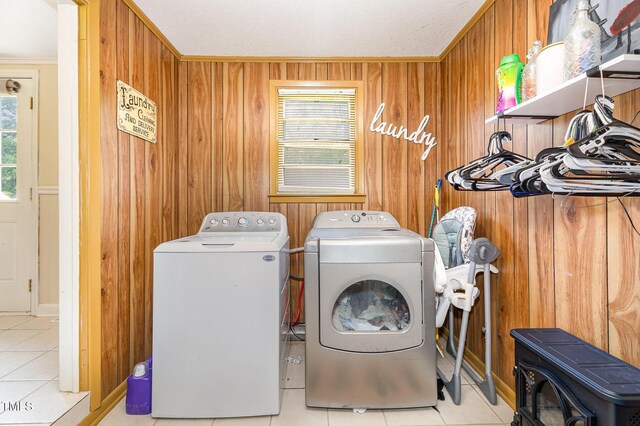 80 Lewis Moody Rd, Bear Creek, NC 27207 - laundry room featuring washer and dryer, tile patterned flooring, crown molding, and wooden walls