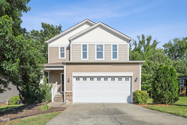 view of front of house featuring a garage and concrete driveway
