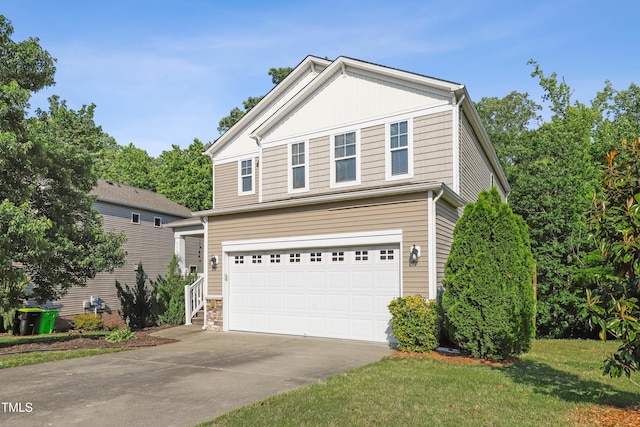 view of front of home featuring concrete driveway, an attached garage, and a front yard