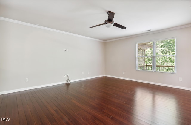 spare room with a ceiling fan, baseboards, ornamental molding, and dark wood-type flooring