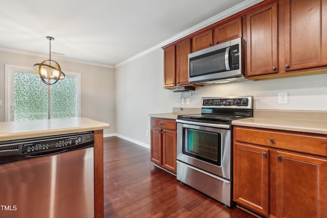 kitchen with stainless steel appliances, dark wood-style floors, ornamental molding, light countertops, and baseboards