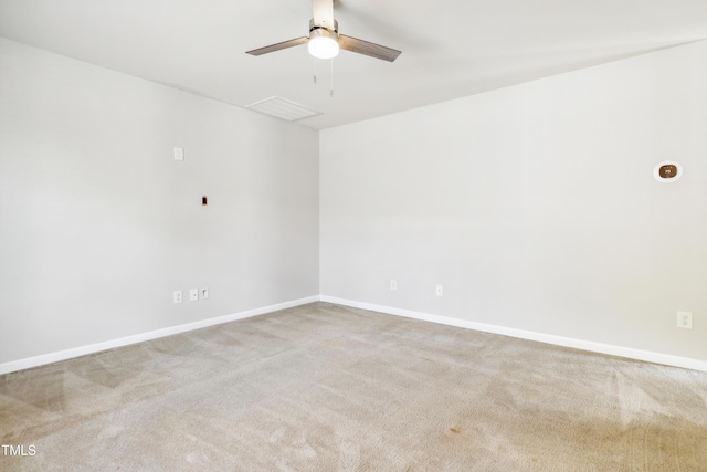 spare room featuring a ceiling fan, carpet flooring, and baseboards
