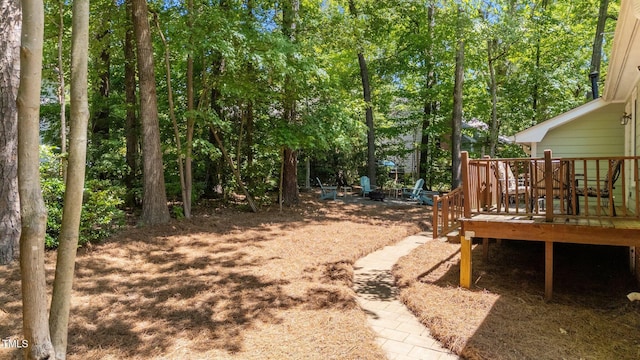 view of yard with a wooden deck