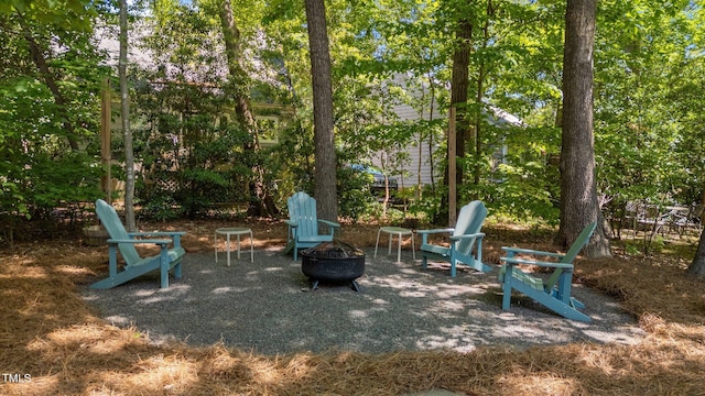 view of patio / terrace featuring a fire pit