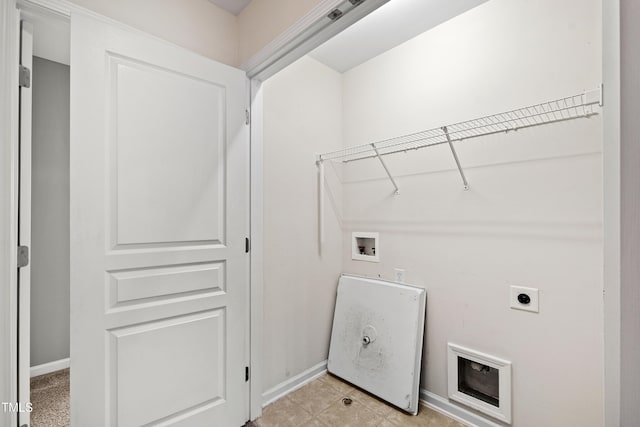 clothes washing area with hookup for a washing machine, baseboards, and electric dryer hookup